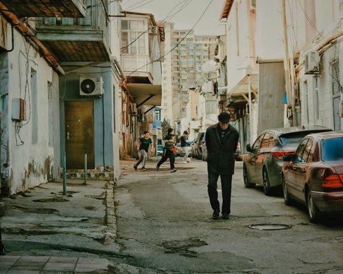 person taking a slow walk in a calm neighbourhood environment